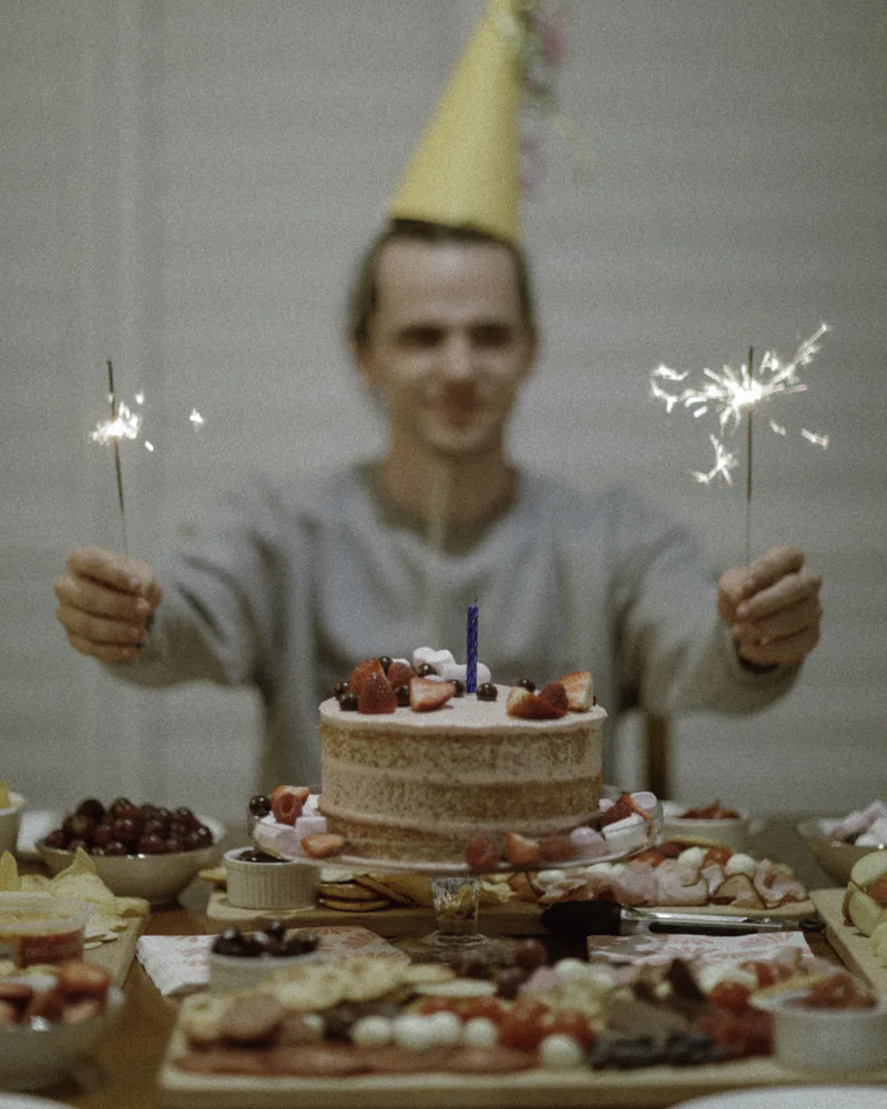Birthday cake with lit sparklers